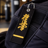 4kpdu1eybt-3.png Haftowany Brelok Karate Kyokushin - Czarny Pas 1 Dan
